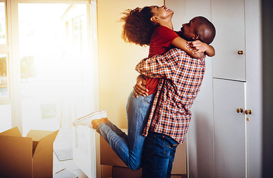 Happy couple after getting financing for new home.